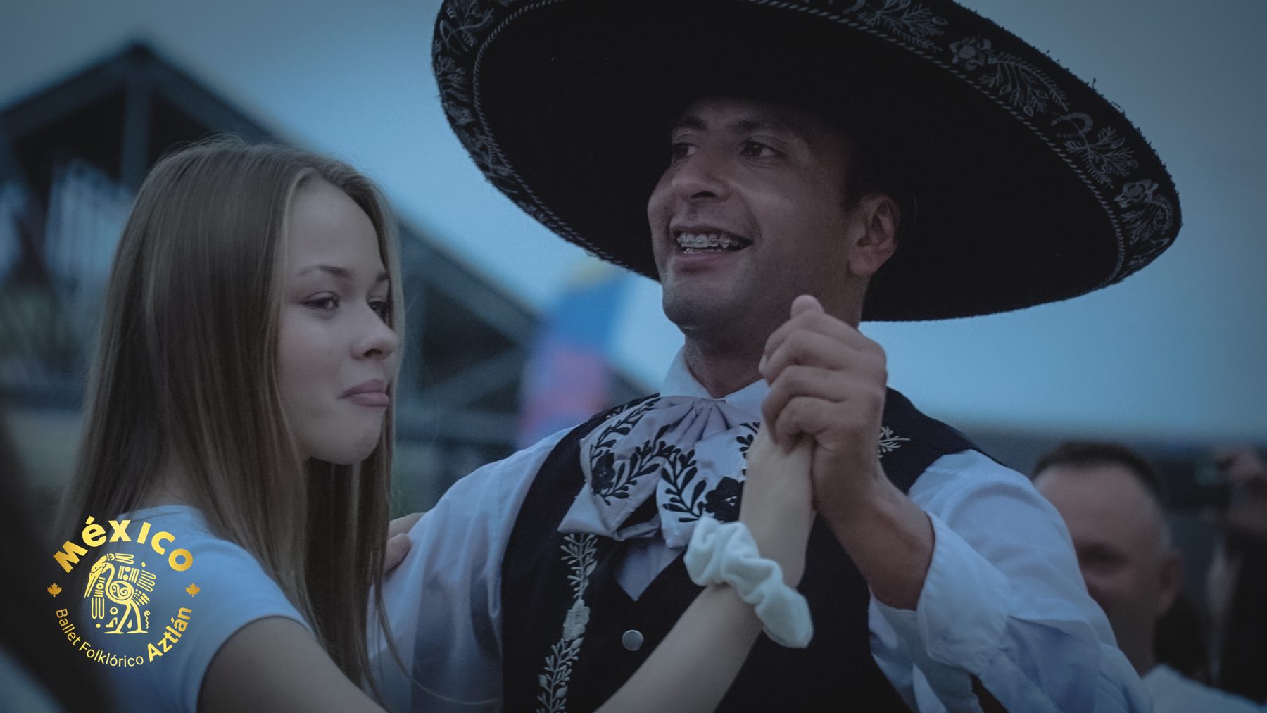 A charro dancing with a guest from the audience in Poland